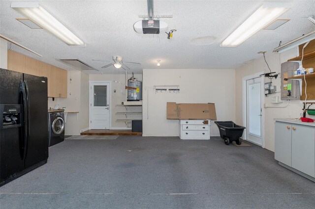 3609 Montclair Dr, New Port Richey, FL 34655 - garage with black refrigerator with ice dispenser, washer / clothes dryer, gas water heater, a garage door opener, and ceiling fan