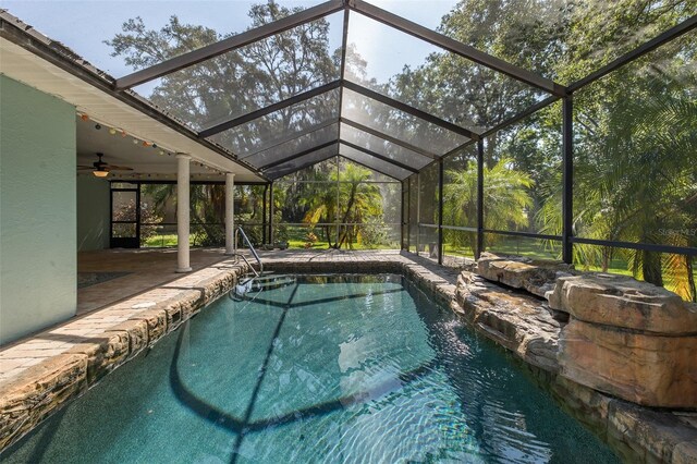 3609 Montclair Dr, New Port Richey, FL 34655 - swimming pool with a patio area, ceiling fan, and a lanai