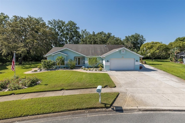 3609 Montclair Dr, New Port Richey, FL 34655 - ranch-style home featuring a front yard, concrete driveway, an attached garage, and stucco siding