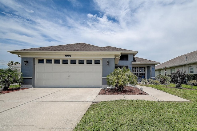 14011 Shoal Dr, Hudson, FL 34667 - ranch-style house with stucco siding, concrete driveway, a garage, and a front lawn
