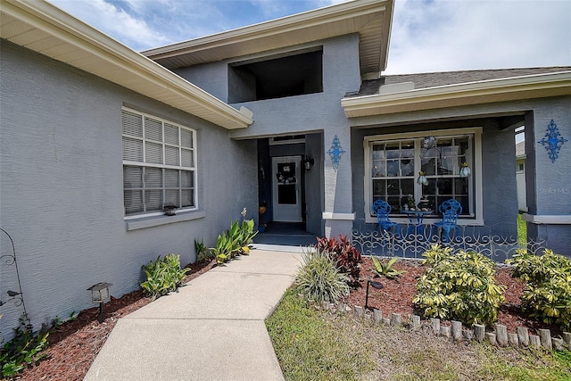 14011 Shoal Dr, Hudson, FL 34667 - doorway to property with stucco siding