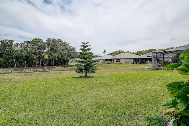 14011 Shoal Dr, Hudson, FL 34667 - view of grassy yard featuring a lanai