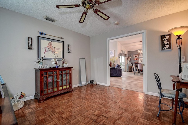 14011 Shoal Dr, Hudson, FL 34667 - office space featuring a ceiling fan, a textured ceiling, and baseboards