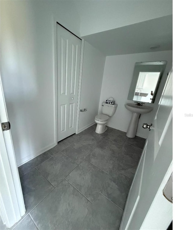 7433 Stone Creek Trl, Kissimmee, FL 34747 - bathroom featuring toilet and tile patterned floors