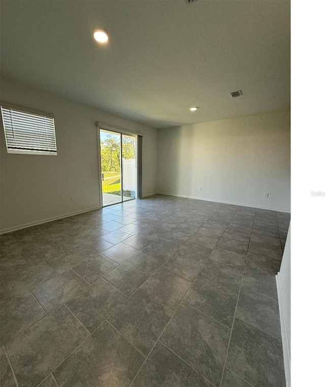 7433 Stone Creek Trl, Kissimmee, FL 34747 - spare room featuring recessed lighting and baseboards