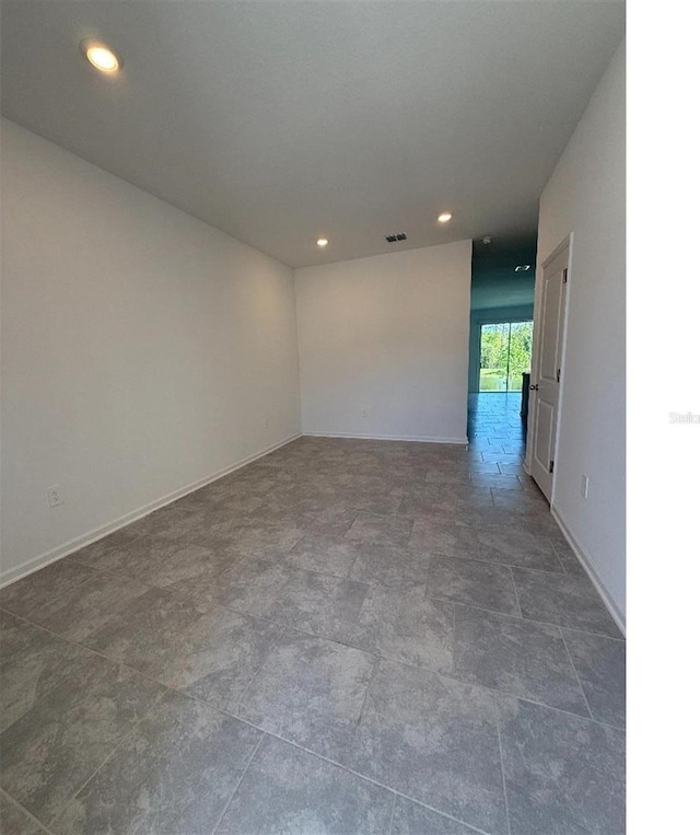 7433 Stone Creek Trl, Kissimmee, FL 34747 - unfurnished room featuring baseboards and recessed lighting