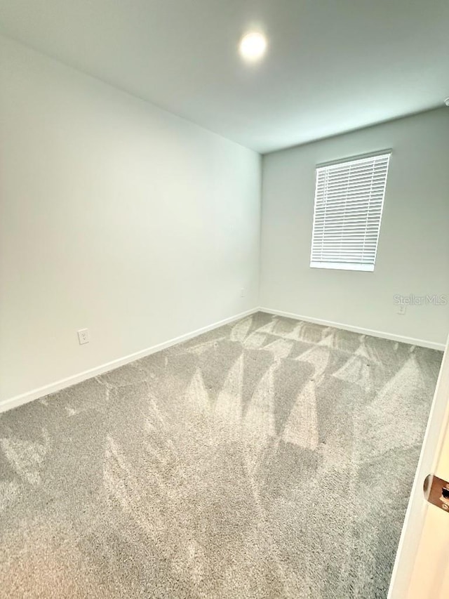 7433 Stone Creek Trl, Kissimmee, FL 34747 - empty room featuring carpet flooring and baseboards