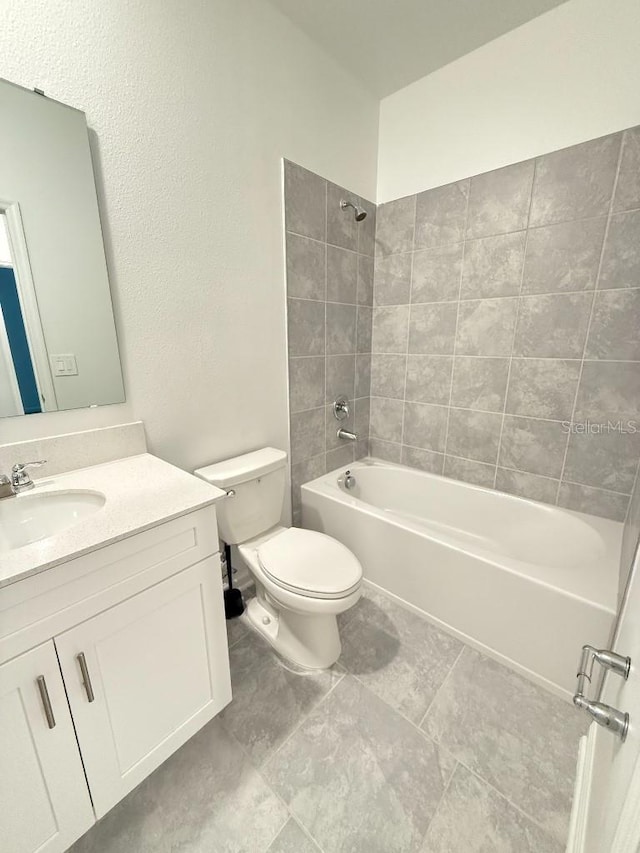 7433 Stone Creek Trl, Kissimmee, FL 34747 - bathroom featuring toilet, vanity, and bathing tub / shower combination