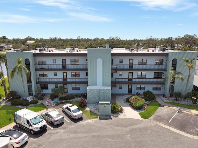 5627 Ferguson Ct Unit 1303, New Port Richey, FL 34652 - view of building exterior featuring uncovered parking