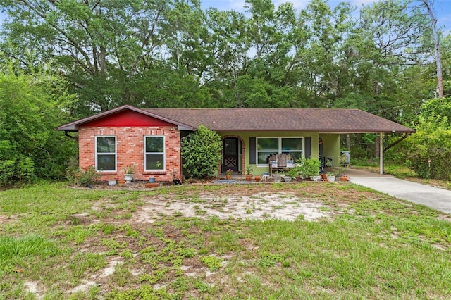 8102 Fort Dade Ave, Brooksville, FL 34601 - ranch-style house featuring an attached carport, driveway, and brick siding