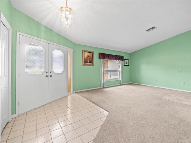 10442 Ventura Dr, Spring Hill, FL 34608 - entrance foyer with a chandelier, carpet flooring, baseboards, and french doors
