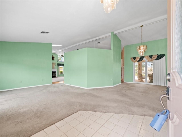 10442 Ventura Dr, Spring Hill, FL 34608 - unfurnished living room featuring vaulted ceiling, a chandelier, carpet, healthy amount of natural light, and baseboards