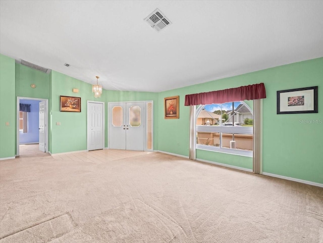 10442 Ventura Dr, Spring Hill, FL 34608 - unfurnished living room featuring carpet flooring, a chandelier, baseboards, and vaulted ceiling