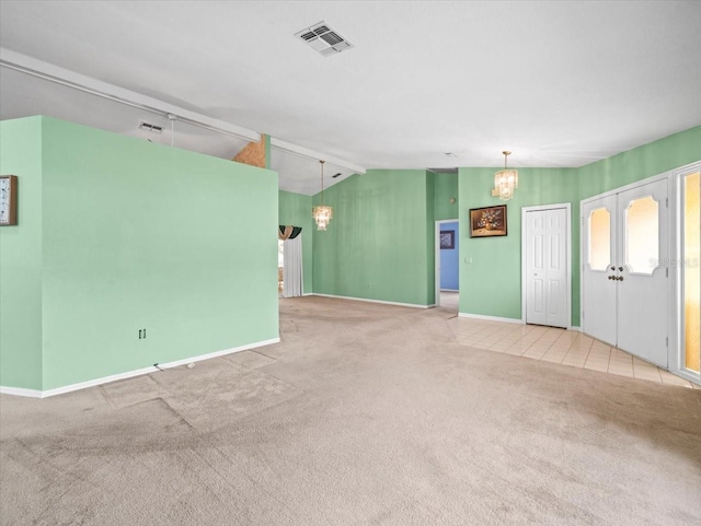 10442 Ventura Dr, Spring Hill, FL 34608 - unfurnished living room with a chandelier, vaulted ceiling, carpet flooring, and baseboards