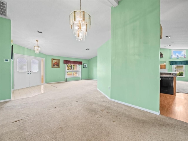 10442 Ventura Dr, Spring Hill, FL 34608 - unfurnished living room with a chandelier, carpet floors, french doors, and baseboards