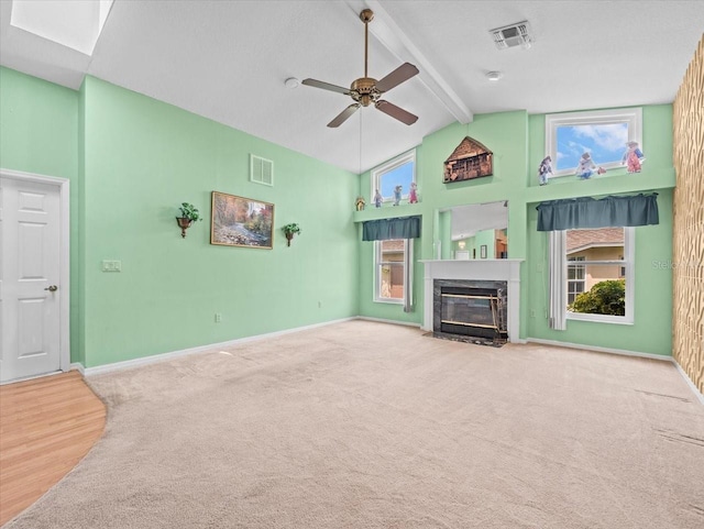 10442 Ventura Dr, Spring Hill, FL 34608 - unfurnished living room with high vaulted ceiling, beamed ceiling, carpet flooring, ceiling fan, and a premium fireplace