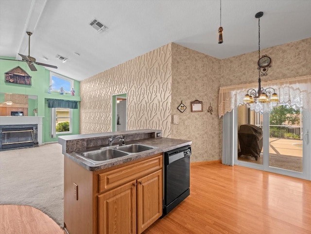 10442 Ventura Dr, Spring Hill, FL 34608 - kitchen with black dishwasher, vaulted ceiling, ceiling fan, a sink, and a chandelier