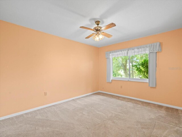 10442 Ventura Dr, Spring Hill, FL 34608 - carpeted spare room with baseboards and a ceiling fan