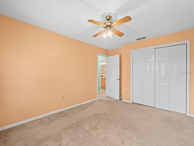 10442 Ventura Dr, Spring Hill, FL 34608 - unfurnished bedroom featuring baseboards, carpet floors, a closet, and a ceiling fan