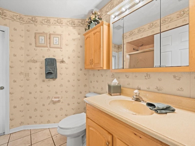 10442 Ventura Dr, Spring Hill, FL 34608 - bathroom with a shower stall, tile patterned floors, vanity, wallpapered walls, and toilet