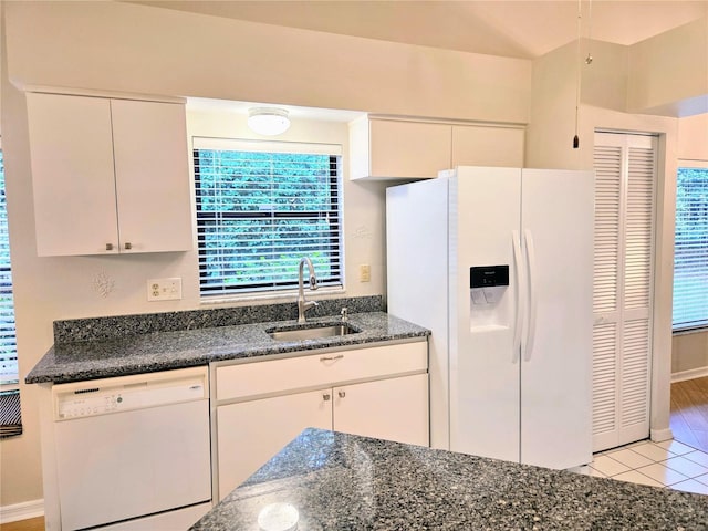3627 Muirfield Ct Unit 3627, New Port Richey, FL 34655 - kitchen featuring white appliances, a sink, white cabinetry, and dark stone counters