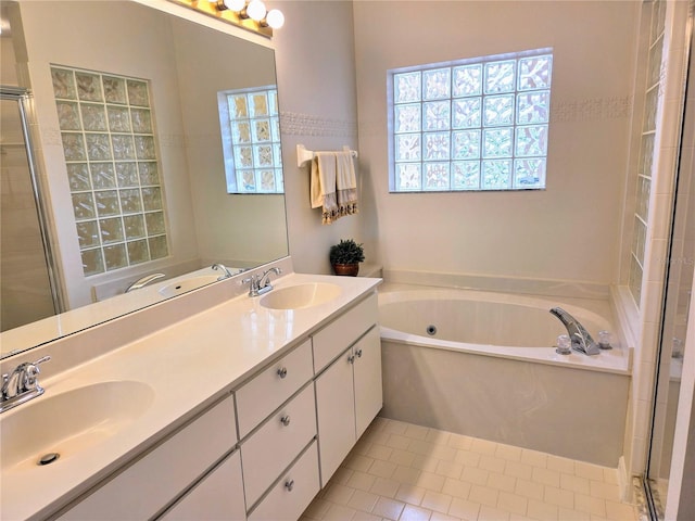 3627 Muirfield Ct Unit 3627, New Port Richey, FL 34655 - full bathroom featuring plenty of natural light, a tub with jets, a shower stall, and double vanity