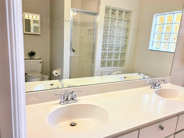 3627 Muirfield Ct Unit 3627, New Port Richey, FL 34655 - full bathroom featuring toilet, a shower stall, and double vanity