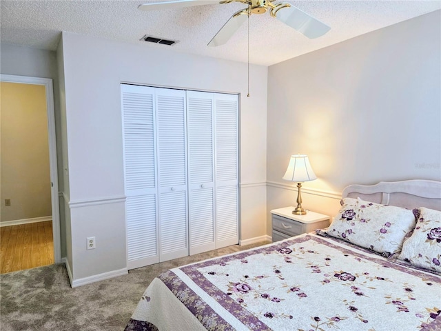 3627 Muirfield Ct Unit 3627, New Port Richey, FL 34655 - carpeted bedroom featuring a closet, a textured ceiling, ceiling fan, and baseboards