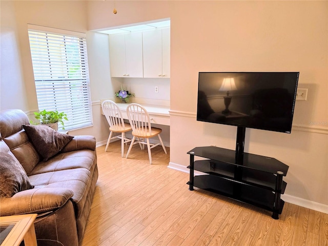 3627 Muirfield Ct Unit 3627, New Port Richey, FL 34655 - living room featuring light wood finished floors and baseboards