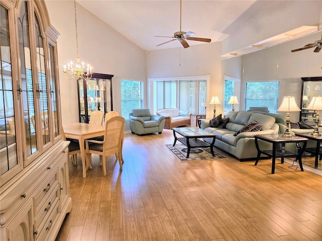3627 Muirfield Ct Unit 3627, New Port Richey, FL 34655 - living room with a ceiling fan, high vaulted ceiling, light wood-style flooring, and a chandelier