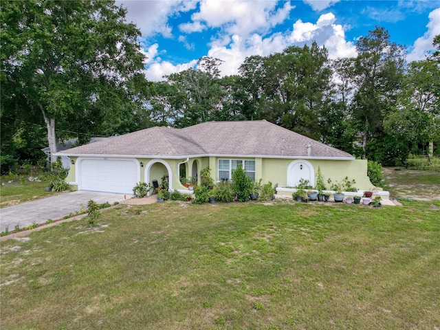 10411 Ireland St, Spring Hill, FL 34608 - single story home with a garage, stucco siding, driveway, and a front lawn