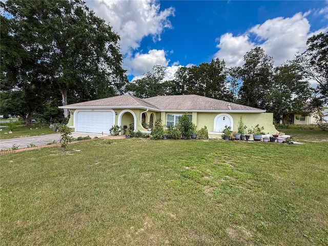10411 Ireland St, Spring Hill, FL 34608 - ranch-style home with driveway, a garage, a front yard, and stucco siding
