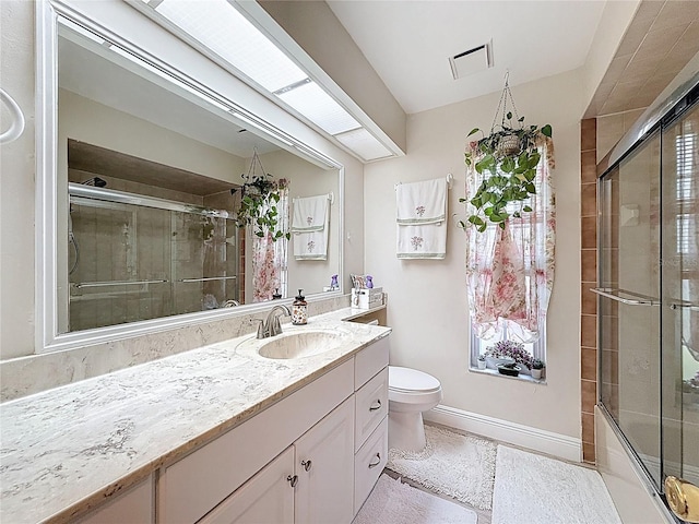 10411 Ireland St, Spring Hill, FL 34608 - full bathroom featuring vanity, a tile shower, toilet, and baseboards