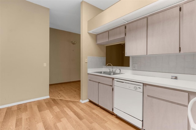 4221 San Rafael Ave, New Port Richey, FL 34655 - kitchen featuring dishwasher, a sink, light countertops, tasteful backsplash, and light wood finished floors