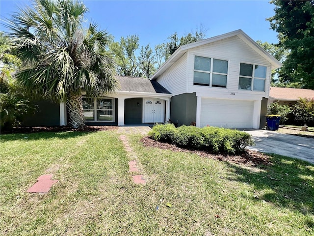 3304 Honeymoon Ln, Holiday, FL 34691 - view of front facade featuring an attached garage, concrete driveway, a front lawn, and stucco siding