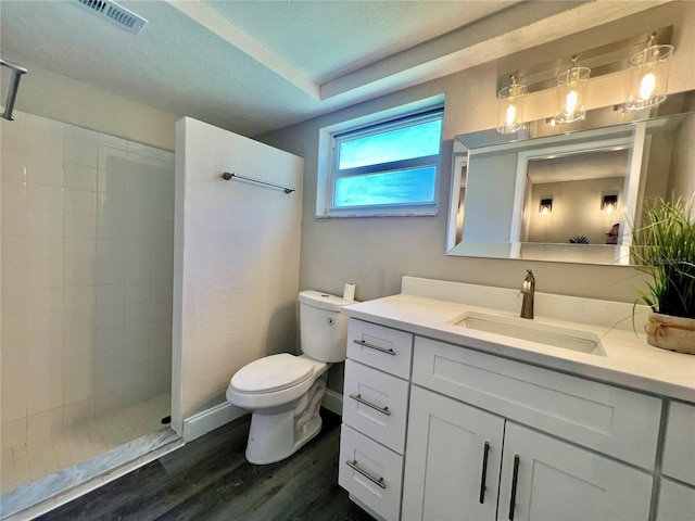 3304 Honeymoon Ln, Holiday, FL 34691 - full bath with wood finished floors, a walk in shower, toilet, and vanity