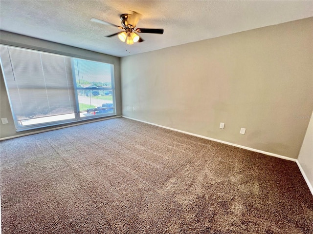 3304 Honeymoon Ln, Holiday, FL 34691 - unfurnished room with carpet, ceiling fan, baseboards, and a textured ceiling