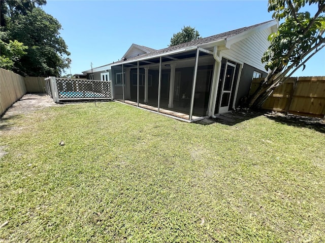 3304 Honeymoon Ln, Holiday, FL 34691 - view of yard featuring a sunroom