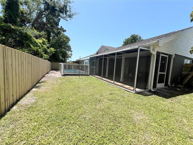 3304 Honeymoon Ln, Holiday, FL 34691 - view of yard featuring a sunroom