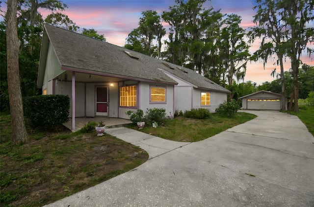 8755 Marigold Dr, New Port Richey, FL 34654 - ranch-style house with an outbuilding, a detached garage, and roof with shingles