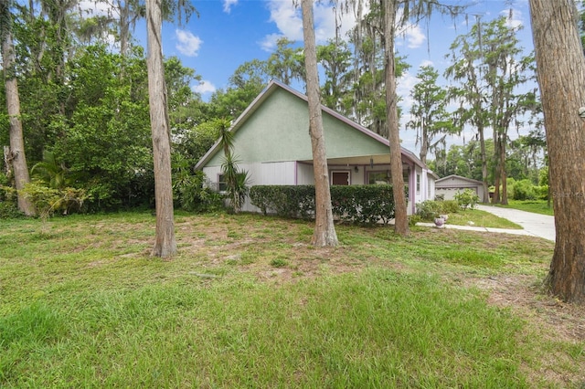 8755 Marigold Dr, New Port Richey, FL 34654 - view of side of home featuring a lawn