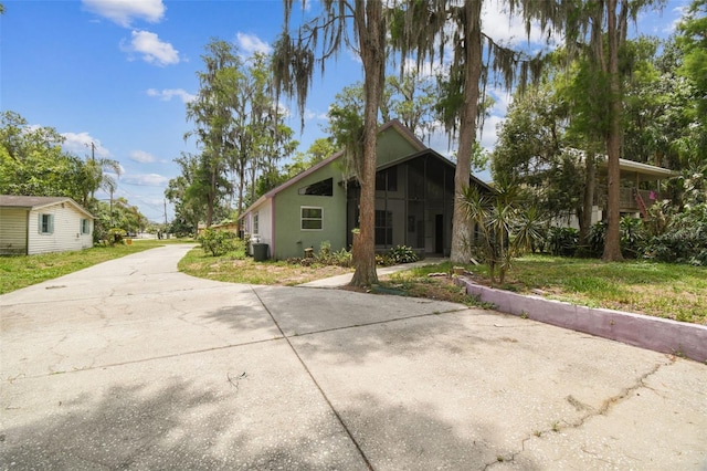 8755 Marigold Dr, New Port Richey, FL 34654 - view of front of house with driveway and stucco siding