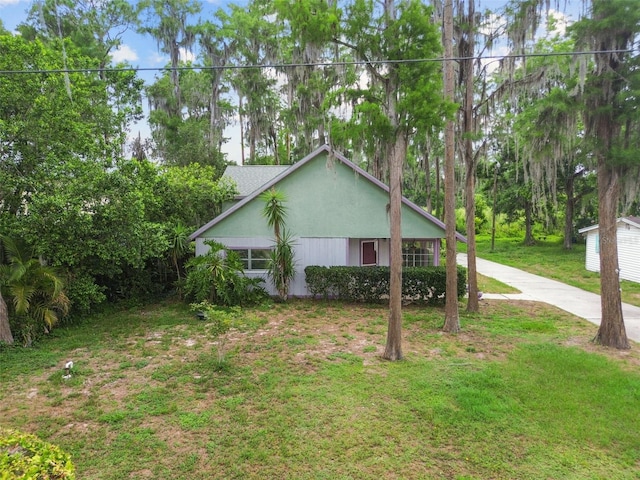 8755 Marigold Dr, New Port Richey, FL 34654 - view of property exterior featuring a lawn