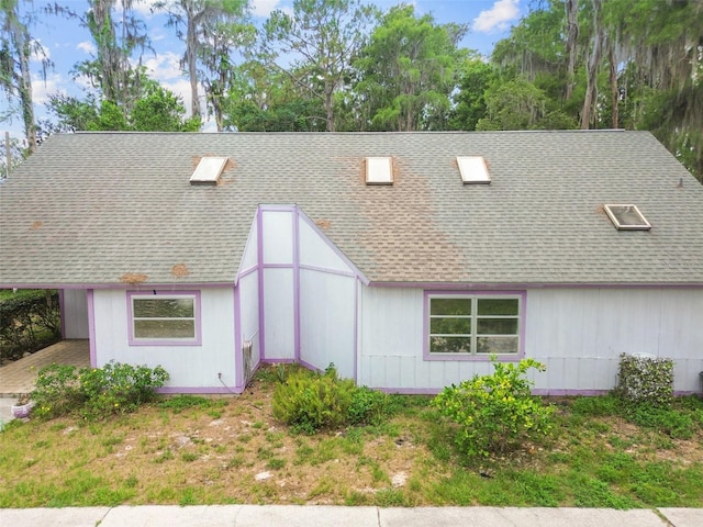 8755 Marigold Dr, New Port Richey, FL 34654 - view of front facade featuring a shingled roof