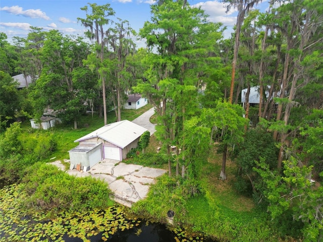 8755 Marigold Dr, New Port Richey, FL 34654 - entry to storm shelter with an outbuilding and view of scattered trees