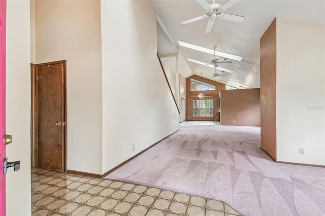 8755 Marigold Dr, New Port Richey, FL 34654 - unfurnished living room with ceiling fan, high vaulted ceiling, carpet flooring, and baseboards