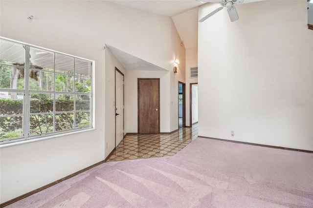 8755 Marigold Dr, New Port Richey, FL 34654 - carpeted spare room featuring ceiling fan, baseboards, and vaulted ceiling