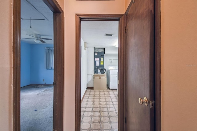 8755 Marigold Dr, New Port Richey, FL 34654 - hallway featuring washer / dryer