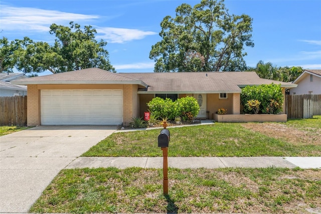 6656 Pinecrest Ln N, Pinellas Park, FL 33781 - single story home with brick siding, an attached garage, and concrete driveway