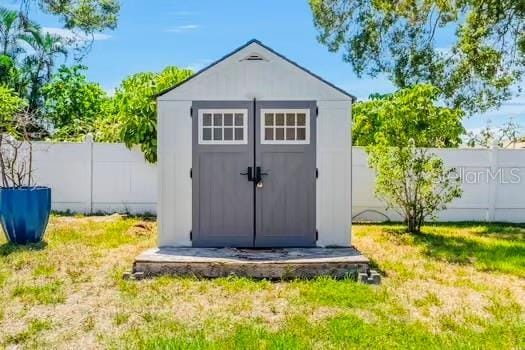 6656 Pinecrest Ln N, Pinellas Park, FL 33781 - view of shed with a fenced backyard